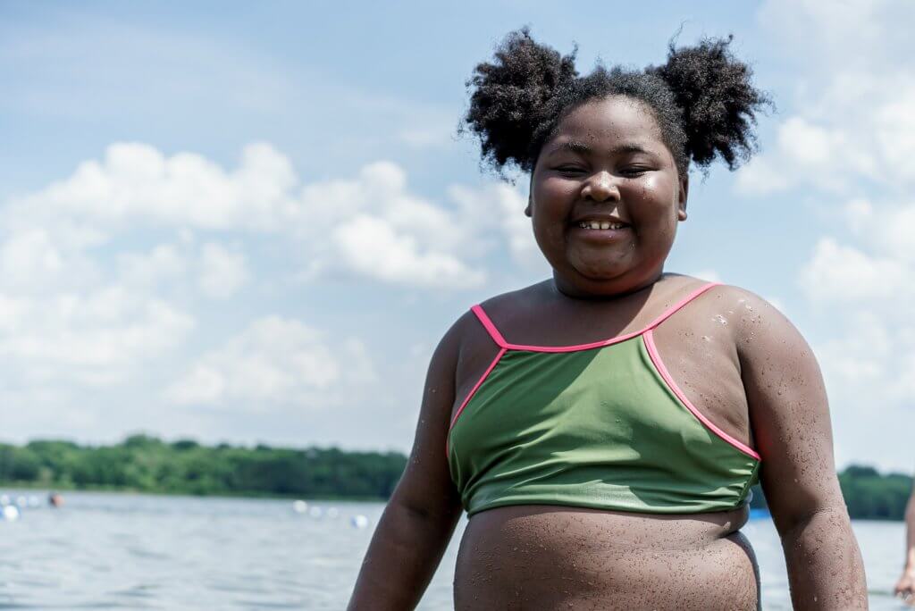 Smiling girl in lake